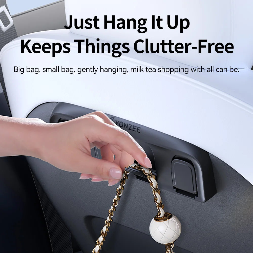 Hand hanging a keychain from a car's headrest with text about keeping things clutter-free.