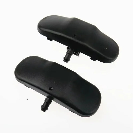 Two black plastic components on a white background